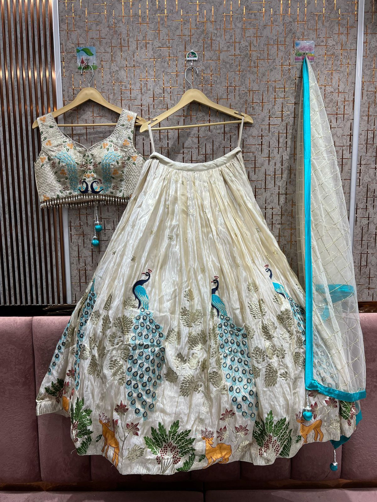 Off-White Embroidered Lehenga with Blue Peacock & Animal Motifs β Luxe Bridal & Event Wear