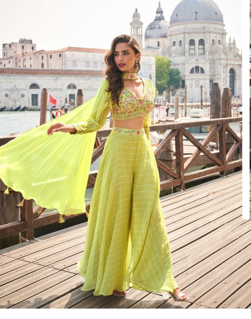 Woman in a bright yellow traditional outfit with a scenic background